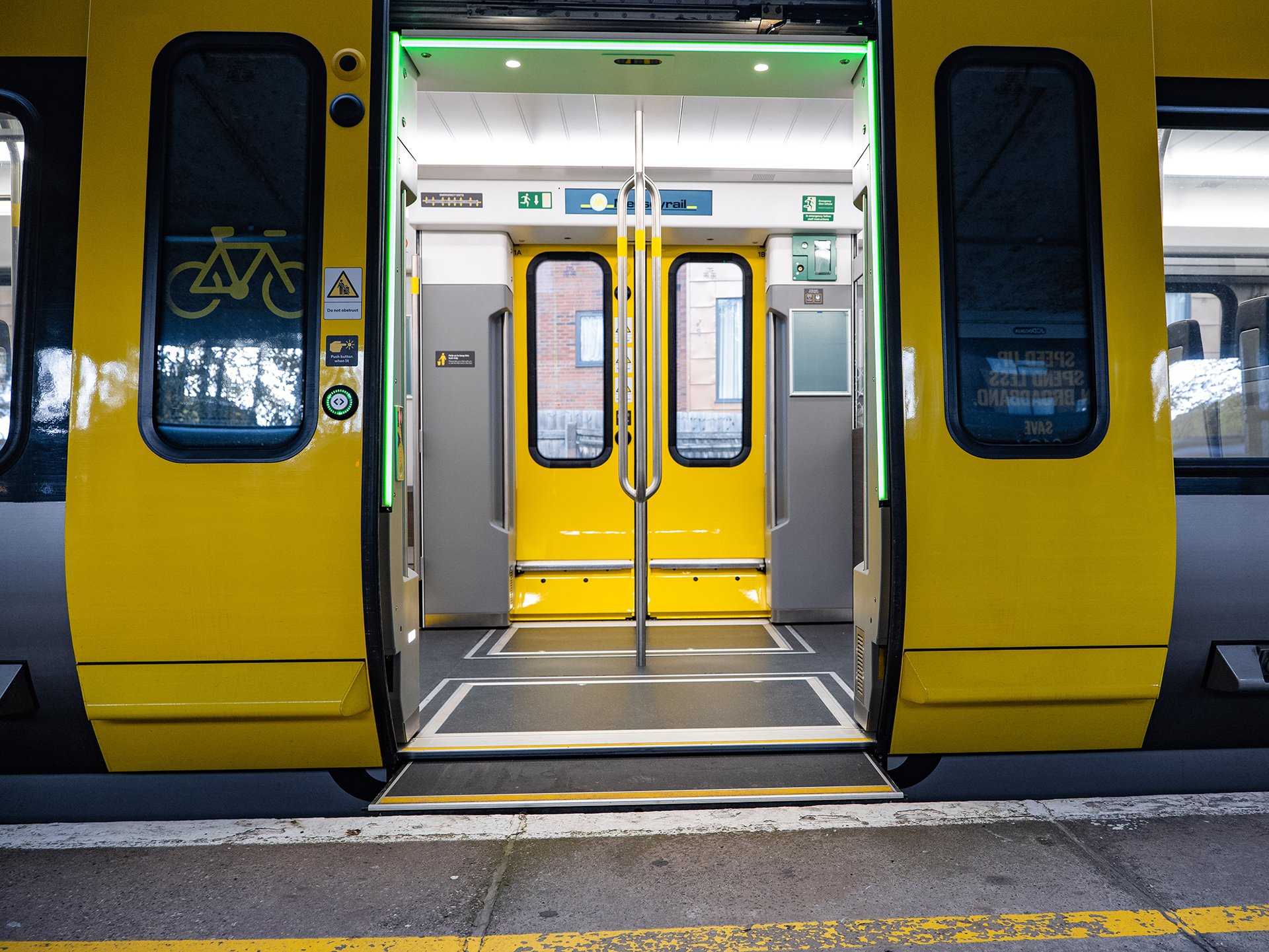 The open doors of a 777 train at station platform