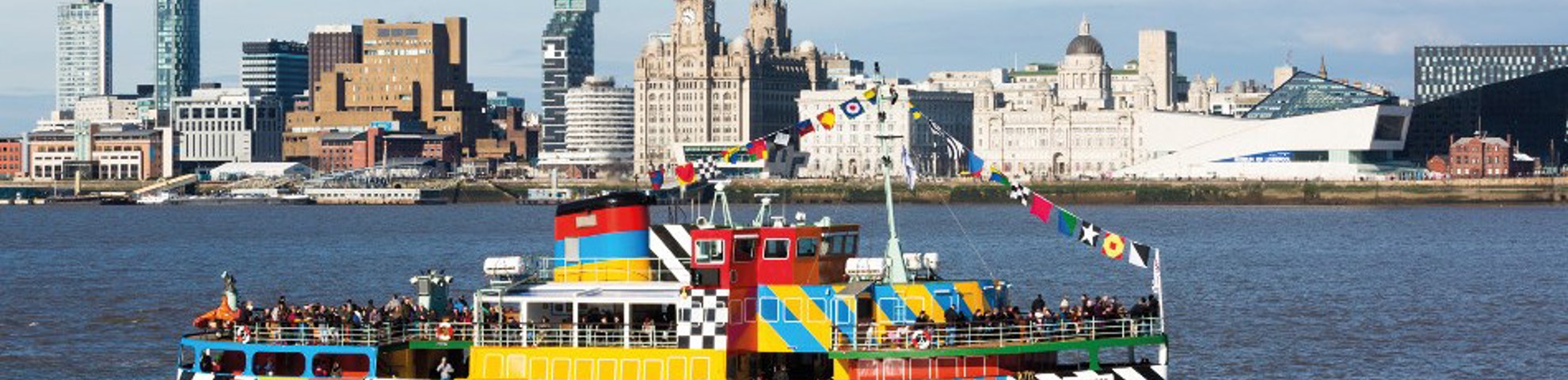 The Merseyferry in the mersey with the liverpool skyline in the background. 