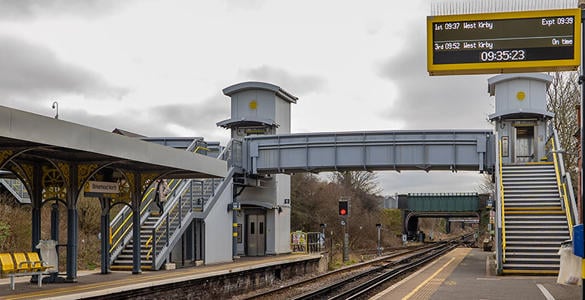The stairway and footbridge above the rail track at Birkenhead North station. 