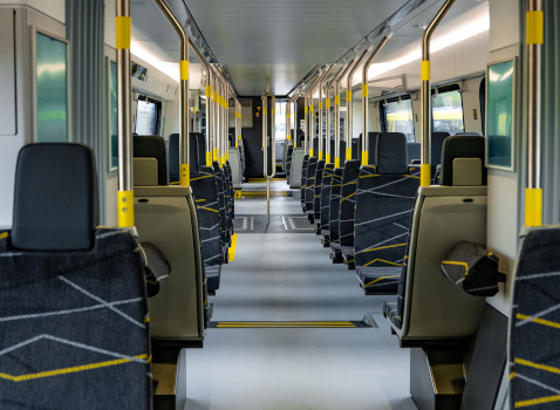 Seats shown inside a 777 train. 