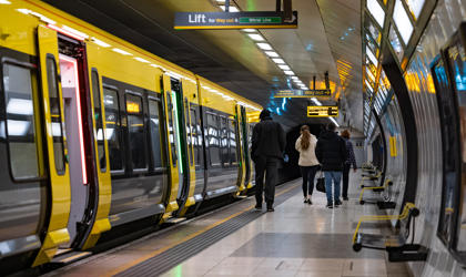 Passengers leaving a platform after departing a train. 