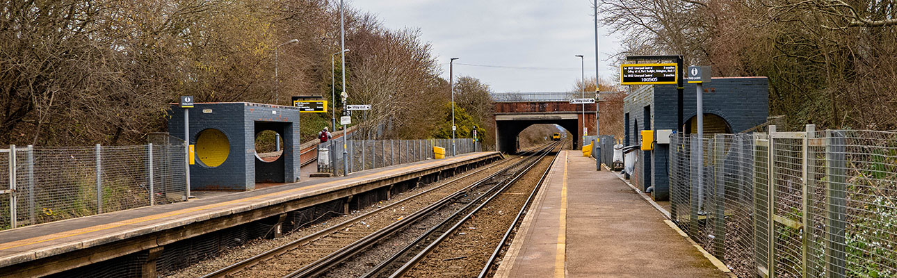 The platform and railway track at Overpool station. 