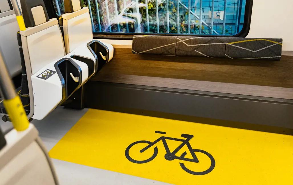 Bike storage on the 777 trains. There is a vinyl of a bike on the floor. 