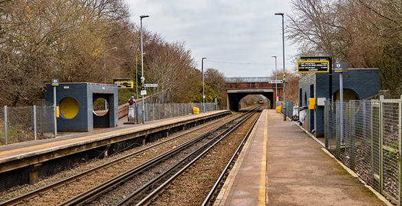 The platform and railway track at Overpool station. 
