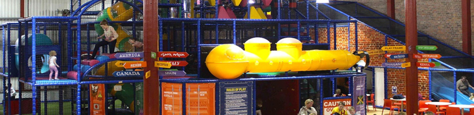 An indoor children's play centre, with a large yellow submarine which children can play in.
